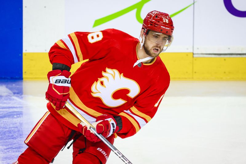 Oct 11, 2023; Calgary, Alberta, CAN; Calgary Flames left wing A.J. Greer (18) skates during the warmup period against the Winnipeg Jets at Scotiabank Saddledome. Mandatory Credit: Sergei Belski-USA TODAY Sports