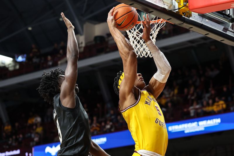 Feb 1, 2025; Minneapolis, Minnesota, USA; Minnesota Golden Gophers center Trey Edmonds (5) shoots as Washington Huskies guard Zoom Diallo (9) defends during the first half at Williams Arena. Mandatory Credit: Matt Krohn-Imagn Images