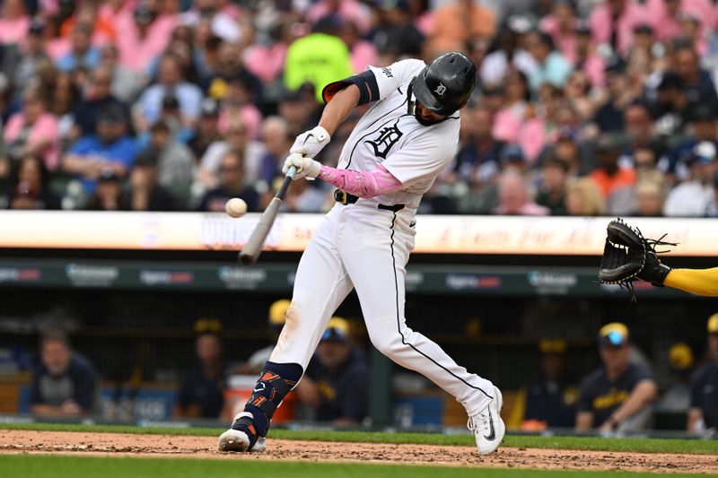 Jun 8, 2024; Detroit, Michigan, USA;  Detroit Tigers center fielder Riley Greene (31) hits a single against the Milwaukee Brewers in the second inning at Comerica Park. Mandatory Credit: Lon Horwedel-USA TODAY Sports