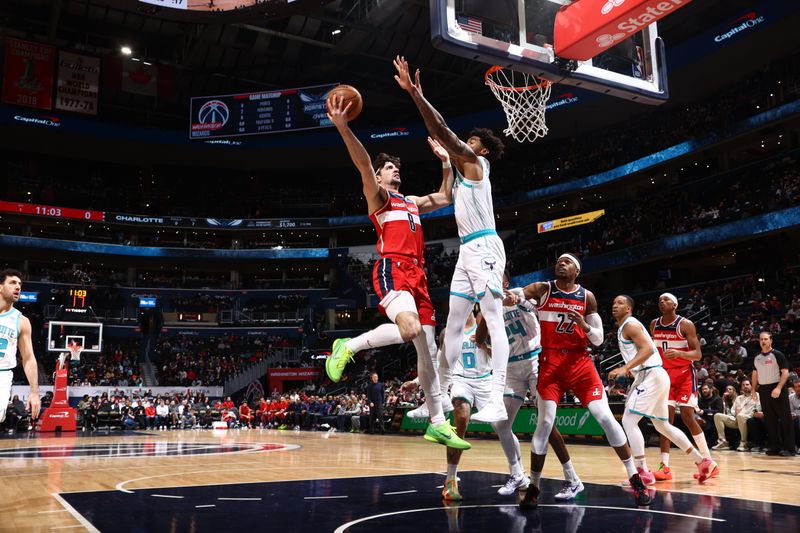 WASHINGTON, DC -? MARCH 8: Deni Avdija #8 of the Washington Wizards drives to the basket during the game against the Charlotte Hornets on March 8, 2024 at Capital One Arena in Washington, DC. NOTE TO USER: User expressly acknowledges and agrees that, by downloading and or using this Photograph, user is consenting to the terms and conditions of the Getty Images License Agreement. Mandatory Copyright Notice: Copyright 2024 NBAE (Photo by Kenny Giarla/NBAE via Getty Images)