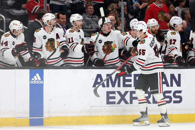 Mar 19, 2024; Los Angeles, California, USA;  Chicago Blackhawks defenseman Kevin Korchinski (55) celebrates with teammates after scoring a goal during the third period against the Los Angeles Kings at Crypto.com Arena. Mandatory Credit: Kiyoshi Mio-USA TODAY Sports