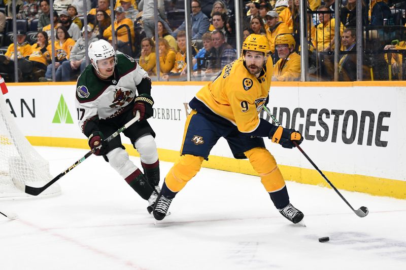 Nov 11, 2023; Nashville, Tennessee, USA; Nashville Predators left wing Filip Forsberg (9) looks to pass the puck during the first period against the Arizona Coyotes at Bridgestone Arena. Mandatory Credit: Christopher Hanewinckel-USA TODAY Sports