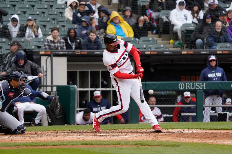 Apr 30, 2023; Chicago, Illinois, USA; Chicago White Sox designated hitter Eloy Jimenez (74) hits a single against the Tampa Bay Rays during the sixth inning at Guaranteed Rate Field. Mandatory Credit: David Banks-USA TODAY Sports