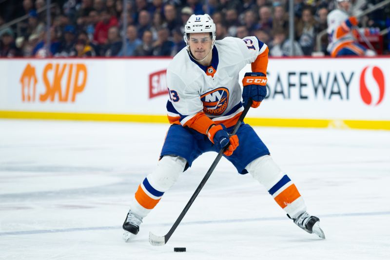 Jan 16, 2024; Winnipeg, Manitoba, CAN; New York Islanders forward Mathew Barzal (13) skates into the Winnipeg Jets    zone during the first period at Canada Life Centre. Mandatory Credit: Terrence Lee-USA TODAY Sports