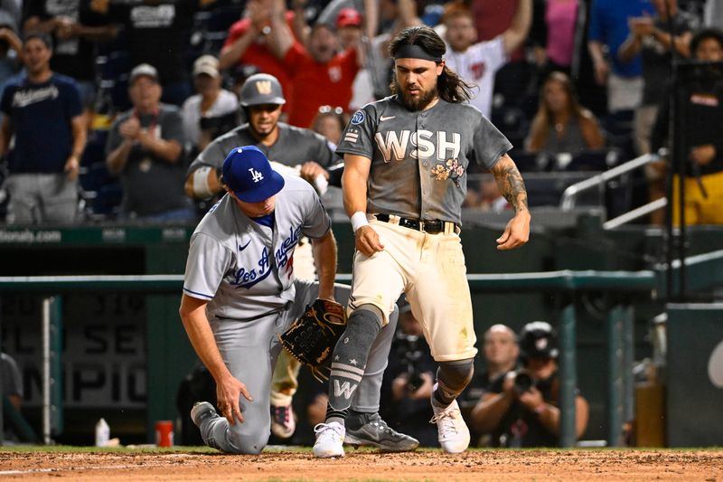 Sep 9, 2023; Washington, District of Columbia, USA; Washington Nationals second baseman Michael Chavis (6) scores teh winning run as Los Angeles Dodgers relief pitcher Gus Varland (58) looks on during the eleventh inning at Nationals Park. Mandatory Credit: Brad Mills-USA TODAY Sports