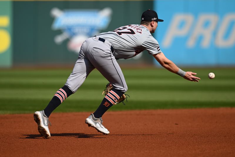 Oct 12, 2024; Cleveland, Ohio, USA; Detroit Tigers shortstop Trey Sweeney (27) throws the ball to second base for an out against the Cleveland Guardians during game five of the ALDS for the 2024 MLB Playoffs at Progressive Field. Mandatory Credit: Ken Blaze-Imagn Images