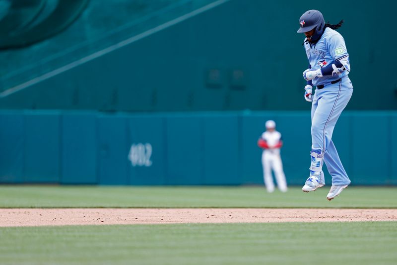 May 5, 2024; Washington, District of Columbia, USA; Toronto Blue Jays first baseman Vladimir Guerrero Jr. (27) celebrates while rounding the bases after hitting a grand slam against the Washington Nationals during the second inning at Nationals Park. Mandatory Credit: Geoff Burke-USA TODAY Sports