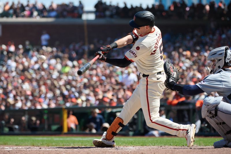 Aug 10, 2024; San Francisco, California, USA; San Francisco Giants outfielder Mike Yastrzemski (5) hits a single against the Detroit Tigers during the eighth inning at Oracle Park. Mandatory Credit: Robert Edwards-USA TODAY Sports