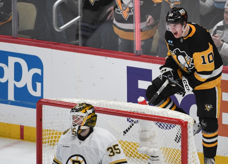 Apr 13, 2024; Pittsburgh, Pennsylvania, USA; Pittsburgh Penguins left wing Drew O’Connor (10) celebrates a score on Boston Bruins goalie Linus Ullmark (35) during the third period at PPG Paints Arena. Mandatory Credit: Philip G. Pavely-USA TODAY Sports