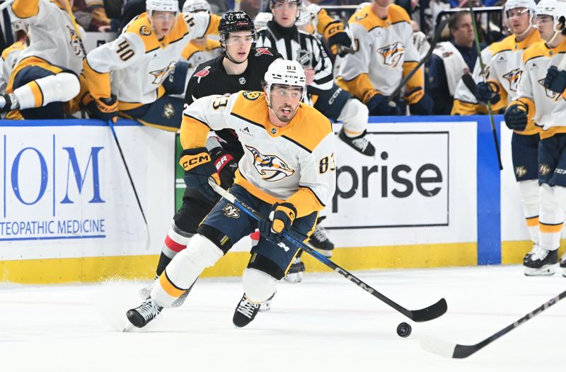 Jan 31, 2025; Buffalo, New York, USA; Nashville Predators defenseman Adam Wilsby (83) handles the puck against the Buffalo Sabres in the first period at the KeyBank Center. Mandatory Credit: Mark Konezny-Imagn Images