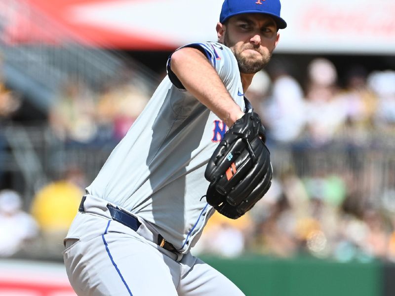 Jul 6, 2024; Pittsburgh, Pennsylvania, USA;  New York Mets starting pitcherDavid Peterson (23) delivers a first-inning pitch against the Pittsburgh Pirates at PNC Park. Mandatory Credit: Philip G. Pavely-USA TODAY Sports