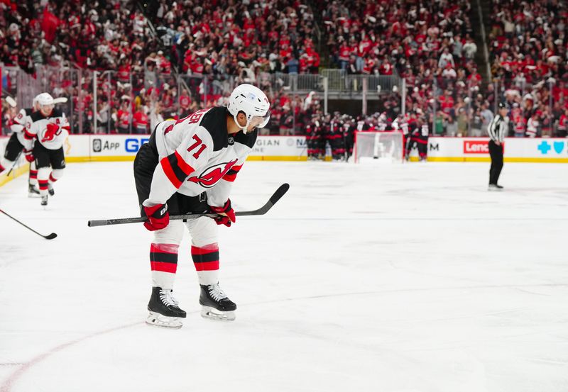 Apr 29, 2025; Raleigh, North Carolina, USA; New Jersey Devils defenseman Jonas Siegenthaler (71) looks on after the loss to the Carolina Hurricanes in the second overtime in game five of the first round of the 2025 Stanley Cup Playoffs at Lenovo Center. Mandatory Credit: James Guillory-Imagn Images