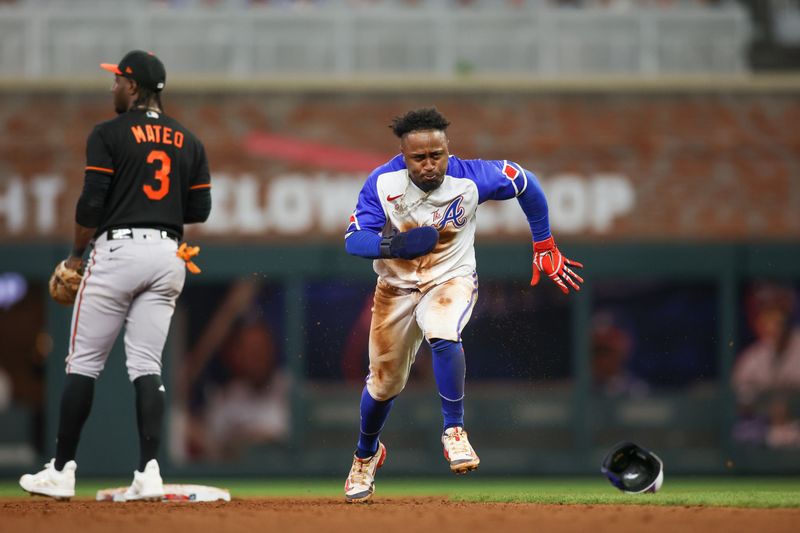 May 6, 2023; Atlanta, Georgia, USA; Atlanta Braves second baseman Ozzie Albies (1) runs to third base against the Baltimore Orioles in the eighth inning at Truist Park. Mandatory Credit: Brett Davis-USA TODAY Sports
