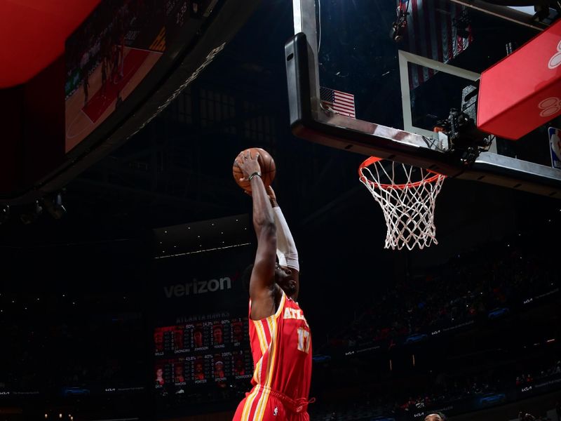 ATLANTA, GA - JANUARY 28: Onyeka Okongwu #17 of the Atlanta Hawks dunks the ball during the game against the Toronto Raptors on January 28, 2024 at State Farm Arena in Atlanta, Georgia.  NOTE TO USER: User expressly acknowledges and agrees that, by downloading and/or using this Photograph, user is consenting to the terms and conditions of the Getty Images License Agreement. Mandatory Copyright Notice: Copyright 2024 NBAE (Photo by Scott Cunningham/NBAE via Getty Images)