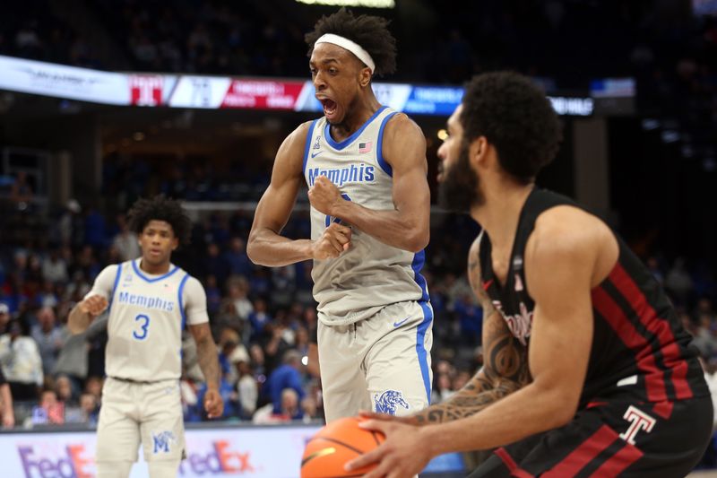 Feb 12, 2023; Memphis, Tennessee, USA; Memphis Tigers forward DeAndre Williams (12) reacts after a charge call during the second half against the Temple Owls at FedExForum. Mandatory Credit: Petre Thomas-USA TODAY Sports