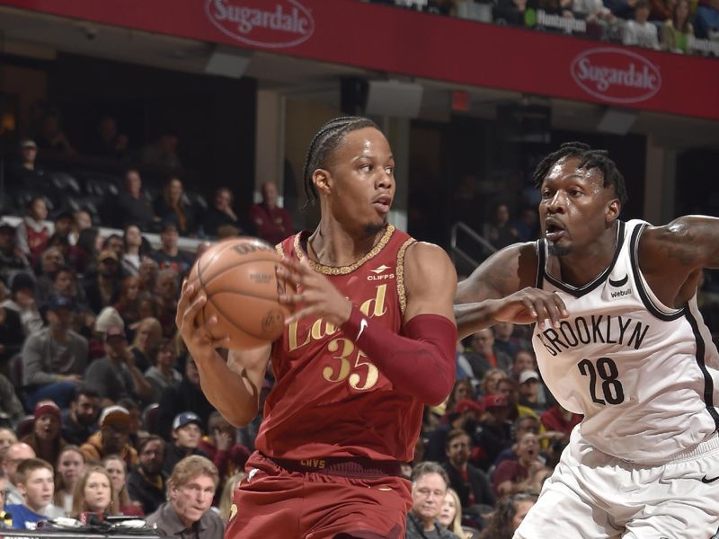 CLEVELAND, OH - MARCH 10: Isaac Okoro #35 of the Cleveland Cavaliers looks to pass the ball during the game against the Brooklyn Nets on March 10, 2024 at Rocket Mortgage FieldHouse in Cleveland, Ohio. NOTE TO USER: User expressly acknowledges and agrees that, by downloading and/or using this Photograph, user is consenting to the terms and conditions of the Getty Images License Agreement. Mandatory Copyright Notice: Copyright 2024 NBAE (Photo by David Liam Kyle/NBAE via Getty Images)