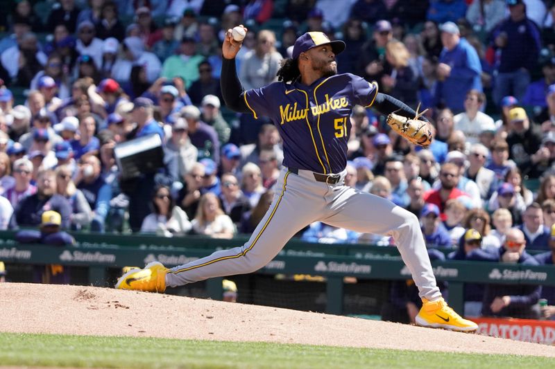 May 5, 2024; Chicago, Illinois, USA; Milwaukee Brewers pitcher Freddy Peralta (51) throws the ball against the Chicago Cubs during the first inning at Wrigley Field. Mandatory Credit: David Banks-USA TODAY Sports