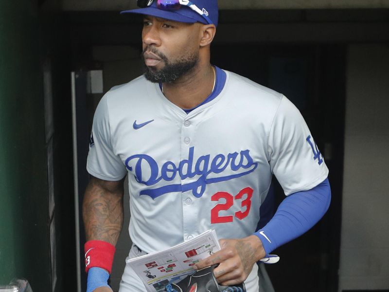 Jun 4, 2024; Pittsburgh, Pennsylvania, USA;  Los Angeles Dodgers right fielder Jason Heyward (23) enters the dugout to play the Pittsburgh Pirates at PNC Park. Mandatory Credit: Charles LeClaire-USA TODAY Sports