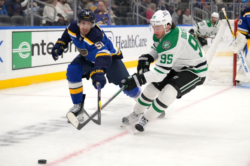 Oct 18, 2025; St. Louis, Missouri, USA; St. Louis Blues defenseman Matthew Kessel (51) pressures Dallas Stars center Matt Duchene (95) during the first period at Enterprise Center. Mandatory Credit: Jeff Le-Imagn Images