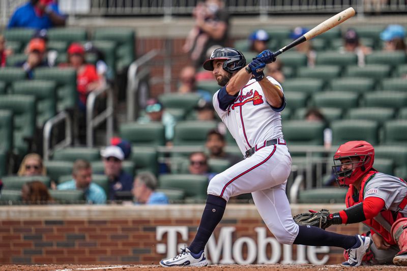 Apr 23, 2025; Cumberland, Georgia, USA; Atlanta Braves outfielder Eli White (36) hits a three run home run against the St. Louis Cardinals during the eighth inning at Truist Park. Mandatory Credit: Dale Zanine-Imagn Images