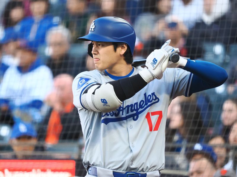 May 14, 2024; San Francisco, California, USA; Los Angeles Dodgers designated hitter Shohei Ohtani (17) on deck against the San Francisco Giants during the first inning at Oracle Park. Mandatory Credit: Kelley L Cox-USA TODAY Sports