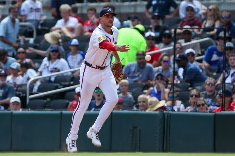 Jul 7, 2024; Atlanta, Georgia, USA; Atlanta Braves first baseman Matt Olson (28) throws a runner out at first against the Philadelphia Phillies in the sixth inning at Truist Park. Mandatory Credit: Brett Davis-USA TODAY Sports
