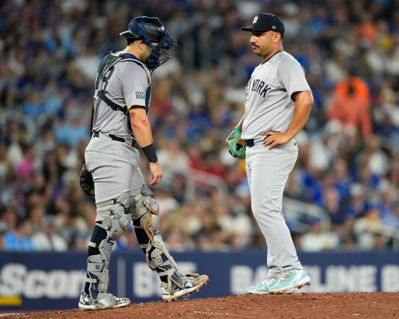 Jun 29, 2024; Toronto, Ontario, CAN; New York Yankees catcher Austin Wells (28) visits pitcher Nestor Cortes (65) during the fourth inning against the Toronto Blue Jays at Rogers Centre. Mandatory Credit: Kevin Sousa-USA TODAY Sports