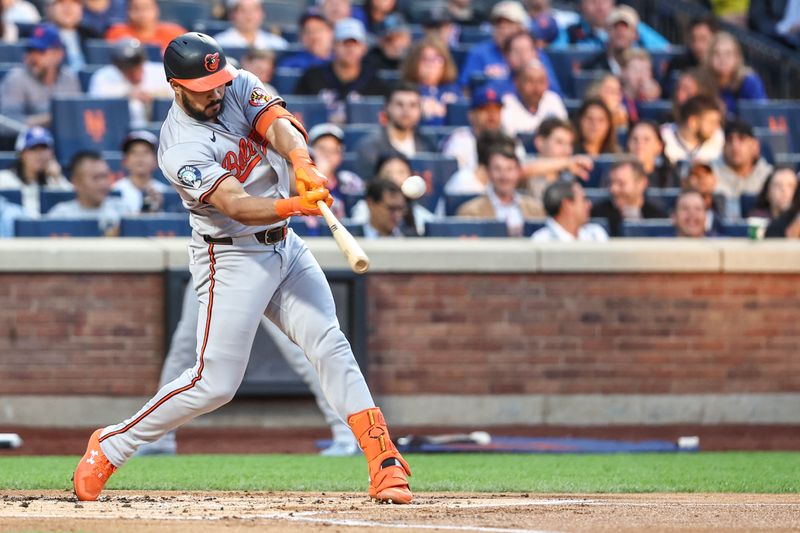 Aug 20, 2024; New York City, New York, USA;  Baltimore Orioles right fielder Anthony Santander (25) hits a two-run home run in the first inning against the New York Mets at Citi Field. Mandatory Credit: Wendell Cruz-USA TODAY Sports