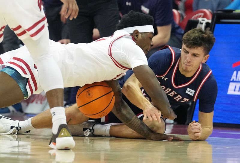 Nov 17, 2023; Madison, Wisconsin, USA; Wisconsin Badgers guard AJ Storr (2) and Robert Morris Colonials guard Alfredo Boglio (6) go after a loose ball during the first half at the Kohl Center. Mandatory Credit: Kayla Wolf-USA TODAY Sports