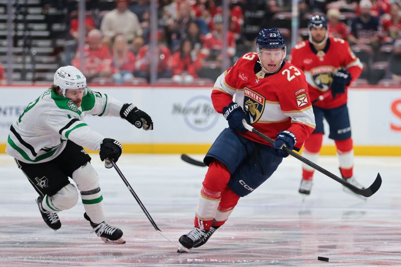 Nov 1, 2025; Sunrise, Florida, USA; Florida Panthers center Carter Verhaeghe (23) moves the puck against Dallas Stars center Sam Steel (18) during the second period at Amerant Bank Arena. Mandatory Credit: Sam Navarro-Imagn Images