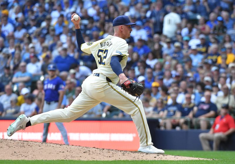 Jun 26, 2024; Milwaukee, Wisconsin, USA; Milwaukee Brewers pitcher Bryan Hudson (52) delivers against the Texas Rangers in the seventh inning at American Family Field. Mandatory Credit: Michael McLoone-USA TODAY Sports