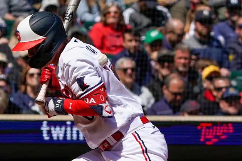 Apr 26, 2023; Minneapolis, Minnesota, USA; Minnesota Twins infielder Jose Miranda (64) is hit by a pitch thrown by New York Yankees pitcher Domingo German (0) during the sixth inning at Target Field. Mandatory Credit: Nick Wosika-USA TODAY Sports

