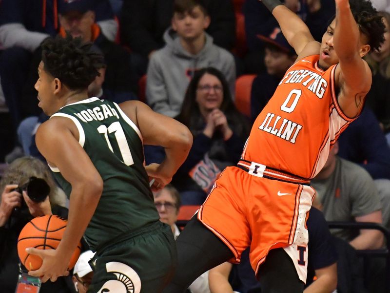 Jan 13, 2023; Champaign, Illinois, USA;  Illinois Fighting Illini guard Terrence Shannon Jr. (0) tries to draw a charging call against Michigan State Spartans guard A.J. Hoggard (11) during the first half at State Farm Center. Mandatory Credit: Ron Johnson-USA TODAY Sports