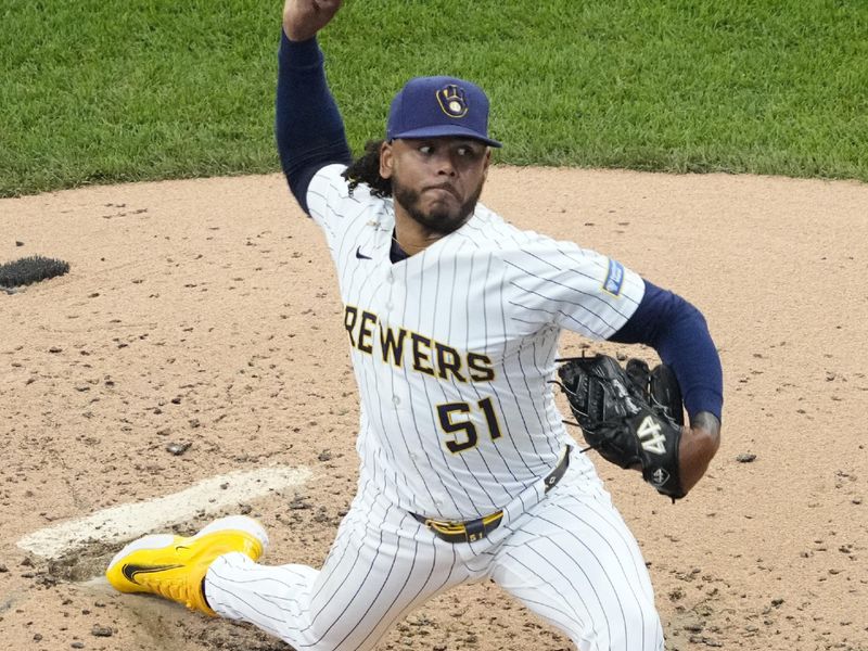 Jun 8, 2025; Milwaukee, Wisconsin, USA; Milwaukee Brewers pitcher Freddy Peralta (51) delivers a pitch against the San Diego Padres in the second inning at American Family Field. Mandatory Credit: Michael McLoone-Imagn Images