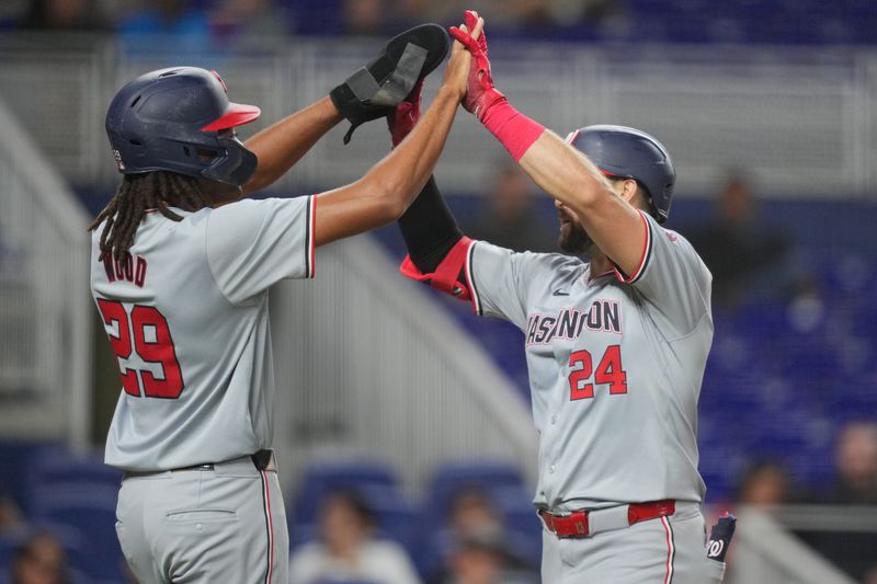 Sep 3, 2024; Miami, Florida, USA;  Washington Nationals first baseman Joey Gallo (24) is congratulated on his three-run home run by left fielder James Wood (29) in the fourth inning against the Miami Marlins at loanDepot Park. Mandatory Credit: Jim Rassol-Imagn Images.