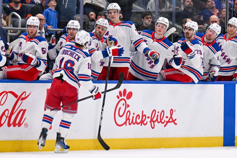 Apr 10, 2025; Elmont, New York, USA;  New York Rangers center Vincent Trocheck (16) celebrate his goal against the New York Islanders during the first period at UBS Arena. Mandatory Credit: Dennis Schneidler-Imagn Images