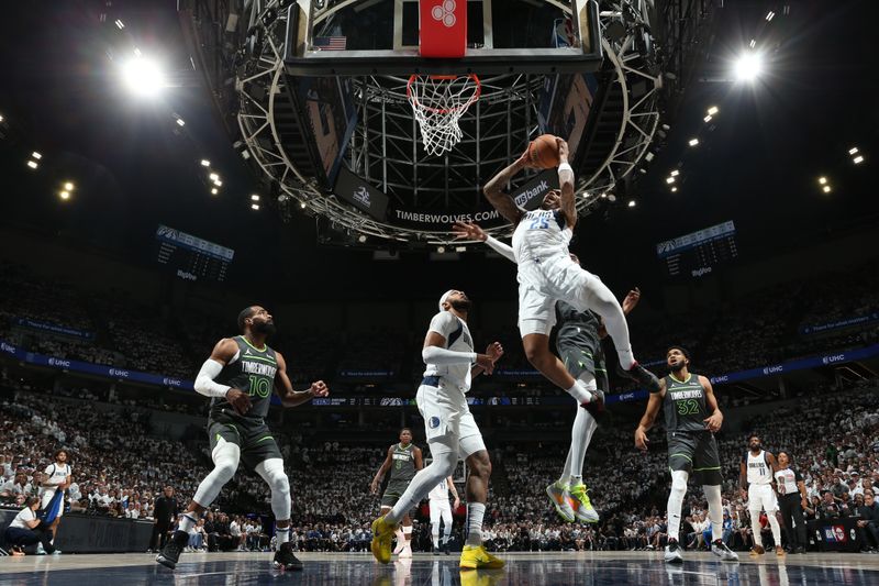 MINNEAPOLIS, MN - MAY 30: PJ Washington #25 of the Dallas Mavericks grabs a rebound during the game against the Minnesota Timberwolves during Game 5 of the Western Conference Finals during the 2024 NBA Playoffs on May 30, 2024 at Target Center in Minneapolis, Minnesota. NOTE TO USER: User expressly acknowledges and agrees that, by downloading and or using this Photograph, user is consenting to the terms and conditions of the Getty Images License Agreement. Mandatory Copyright Notice: Copyright 2024 NBAE (Photo by David Sherman/NBAE via Getty Images)