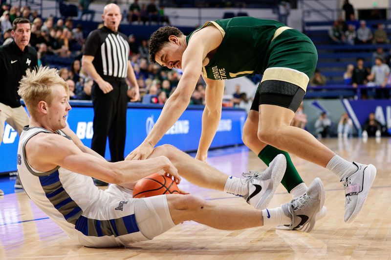 Mar 9, 2024; Colorado Springs, Colorado, USA; Air Force Falcons forward Rytis Petraitis (31) and Colorado State Rams forward Joel Scott (1) battle for the ball in the first half at Clune Arena. Mandatory Credit: Isaiah J. Downing-USA TODAY Sports