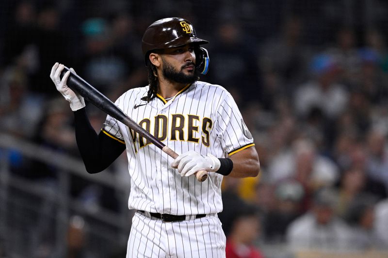 Aug 21, 2023; San Diego, California, USA; San Diego Padres right fielder Fernando Tatis (23) looks on after striking out to end the fourth inning against the Miami Marlins at Petco Park. Mandatory Credit: Orlando Ramirez-USA TODAY Sports