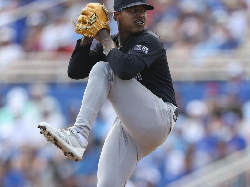 Mar 8, 2024; Dunedin, Florida, USA;  New York Yankees starting pitcher Marcus Stroman (0) throws a pitch against the Toronto Blue Jays in the first inning at TD Ballpark. Mandatory Credit: Nathan Ray Seebeck-USA TODAY Sports