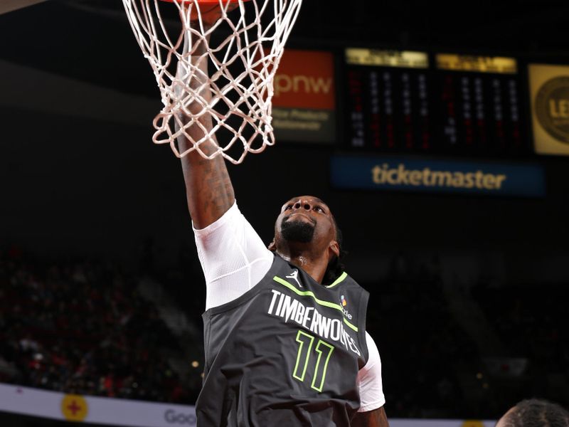 PORTLAND, OR - NOVEMBER 13: Naz Reid #11 of the Minnesota Timberwolves dunks the ball during the game against the Portland Trail Blazers on November 13, 2024 at the Moda Center Arena in Portland, Oregon. NOTE TO USER: User expressly acknowledges and agrees that, by downloading and or using this photograph, user is consenting to the terms and conditions of the Getty Images License Agreement. Mandatory Copyright Notice: Copyright 2024 NBAE (Photo by Cameron Browne/NBAE via Getty Images)