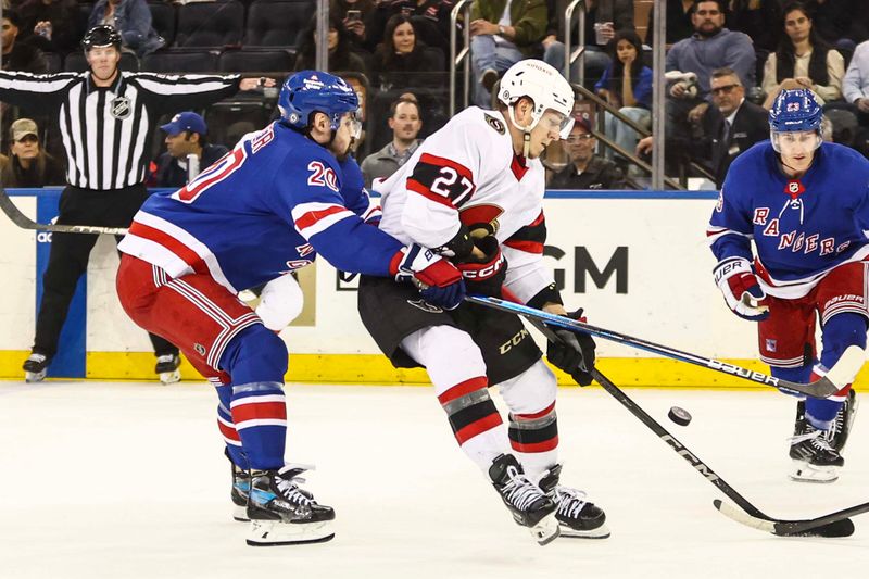 Apr 15, 2024; New York, New York, USA;  New York Rangers left wing Chris Kreider (20) and Ottawa Senators left wing Parker Kelly (27) battle for control of the puck in the second period at Madison Square Garden. Mandatory Credit: Wendell Cruz-USA TODAY Sports