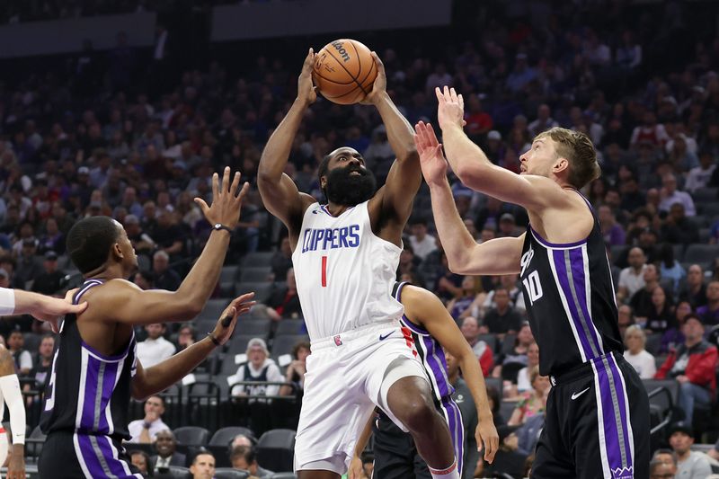 SACRAMENTO, CALIFORNIA - APRIL 02: James Harden #1 of the LA Clippers goes up for a shot on De'Aaron Fox #5 and Domantas Sabonis #10 of the Sacramento Kings  in the first half at Golden 1 Center on April 02, 2024 in Sacramento, California. NOTE TO USER: User expressly acknowledges and agrees that, by downloading and or using this photograph, User is consenting to the terms and conditions of the Getty Images License Agreement.  (Photo by Ezra Shaw/Getty Images)