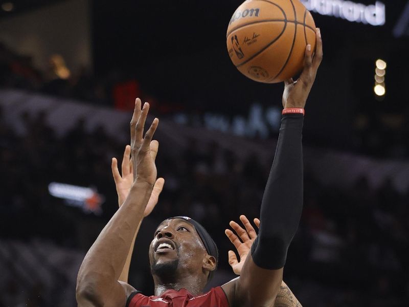 SAN ANTONIO, TX - NOVEMBER 12: Bam Adebayo #13 of the Miami Heat shots over the San Antonio Spurs in the second half at Frost Bank Center on November 12, 2023 in San Antonio, Texas. NOTE TO USER: User expressly acknowledges and agrees that, by downloading and or using this photograph, User is consenting to terms and conditions of the Getty Images License Agreement. (Photo by Ronald Cortes/Getty Images)