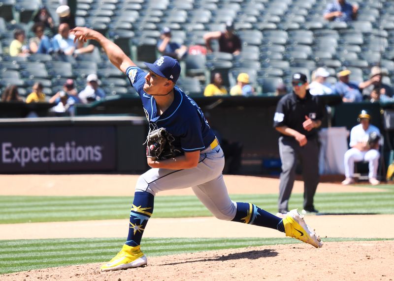 Jun 15, 2023; Oakland, California, USA; Tampa Bay Rays relief pitcher Robert Stephenson (26) pitches the ball against the Oakland Athletics during the seventh inning at Oakland-Alameda County Coliseum. Mandatory Credit: Kelley L Cox-USA TODAY Sports