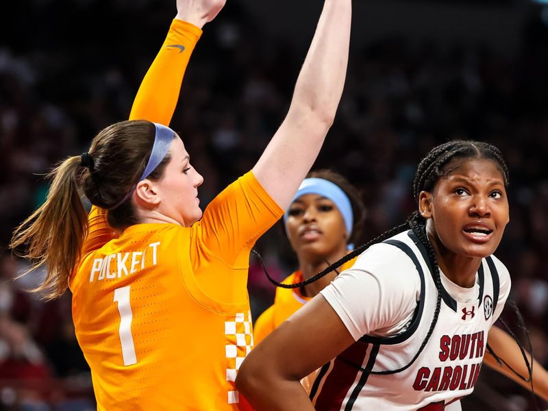 Mar 3, 2024; Columbia, South Carolina, USA; South Carolina Gamecocks forward Sania Feagin (20) gets around Tennessee Lady Vols guard Sara Puckett (1) in the first half at Colonial Life Arena. Mandatory Credit: Jeff Blake-USA TODAY Sports