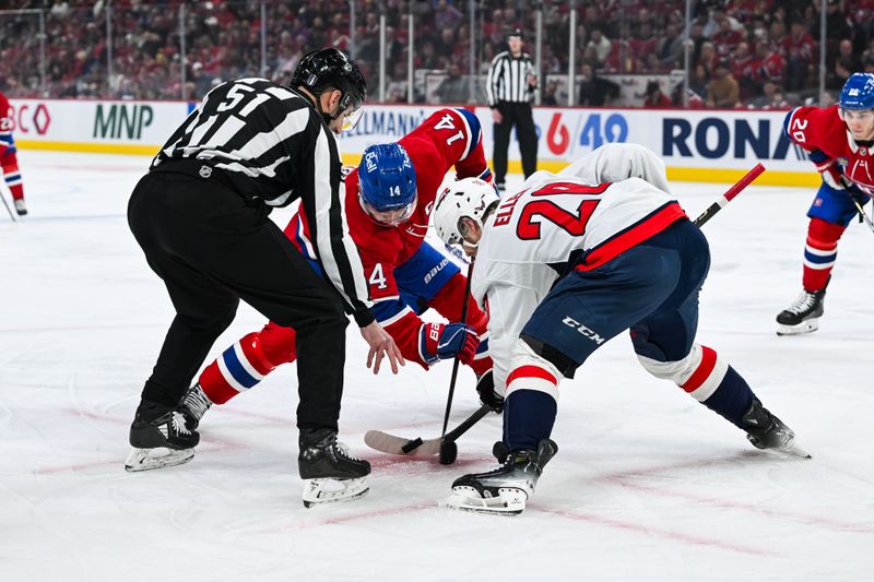 Apr 27, 2025; Montreal, Quebec, CAN; NHL linesman Andrew Smith (51) drops the puck at a face-off between Montreal Canadiens center Nick Suzuki (14) and Washington Capitals center Lars Eller (20) during the first period in game four of the first round of the 2025 Stanley Cup Playoffs at Bell Centre. Mandatory Credit: David Kirouac-Imagn Images