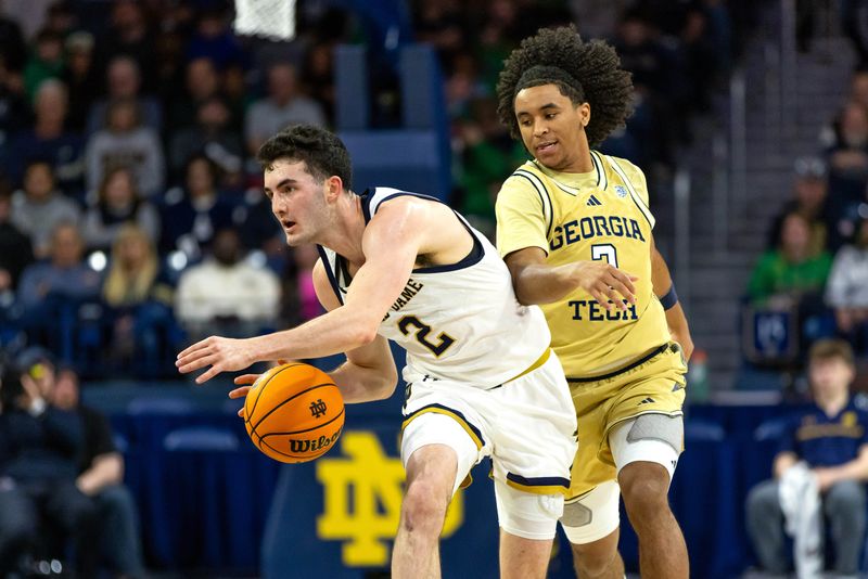 Feb 14, 2026; South Bend, Indiana, USA; Notre Dame Fighting Irish guard Logan Imes (2) drives down the court as Georgia Tech Yellow Jackets guard Eric Chatfield Jr. (2) defends during the first half at Purcell Pavilion at the Joyce Center. Mandatory Credit: Michael Caterina-Imagn Images