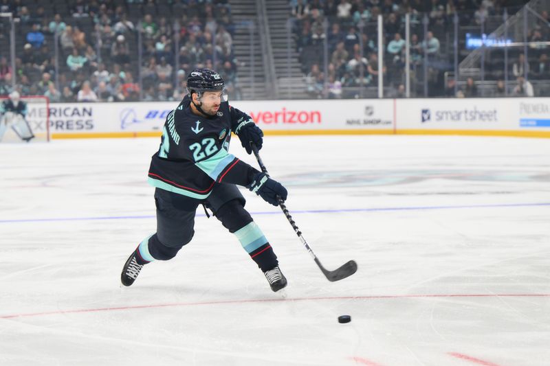 Oct 2, 2024; Seattle, Washington, USA; Seattle Kraken right wing Oliver Bjorkstrand (22) shoots the puck against the Edmonton Oilers during the first period at Climate Pledge Arena. Mandatory Credit: Steven Bisig-Imagn Images