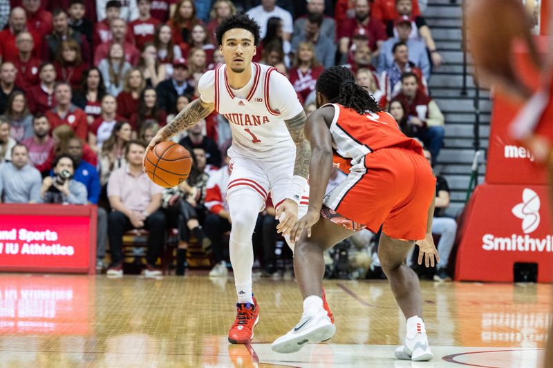 Jan 28, 2023; Bloomington, Indiana, USA; Indiana Hoosiers guard Jalen Hood-Schifino (1) dribbles the ball while Ohio State Buckeyes guard Bruce Thornton (2) defends in the first half at Simon Skjodt Assembly Hall. Mandatory Credit: Trevor Ruszkowski-USA TODAY Sports